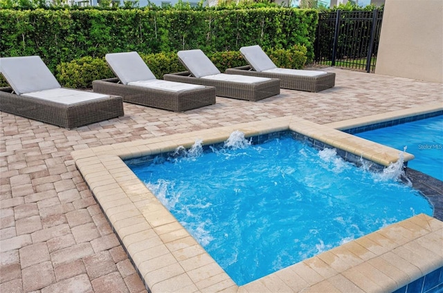 view of pool with fence, a patio area, and a pool