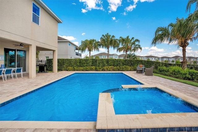 view of swimming pool with ceiling fan, outdoor dining area, a residential view, a fenced in pool, and a patio