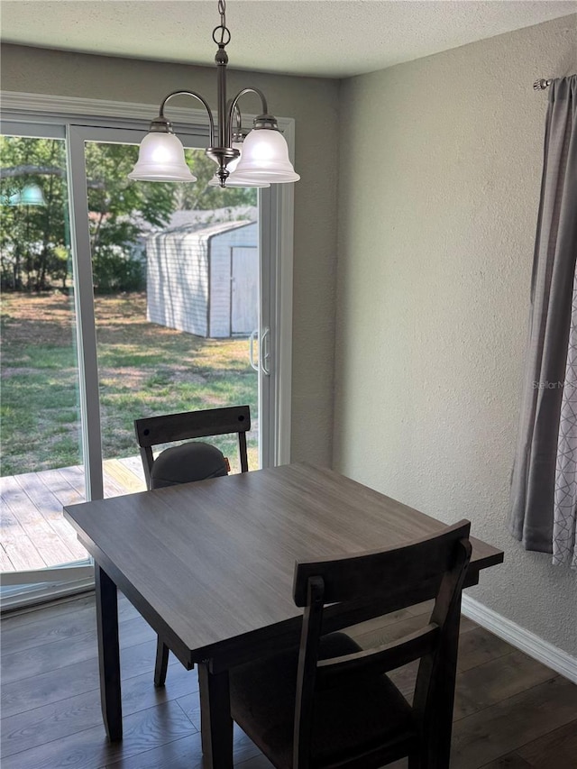 9400 SE 119th St, Belleview, FL 34420 - dining area with dark wood finished floors, baseboards, a textured wall, and a textured ceiling