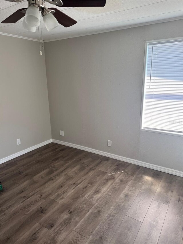 9400 SE 119th St, Belleview, FL 34420 - unfurnished room featuring dark wood finished floors, crown molding, a ceiling fan, and baseboards