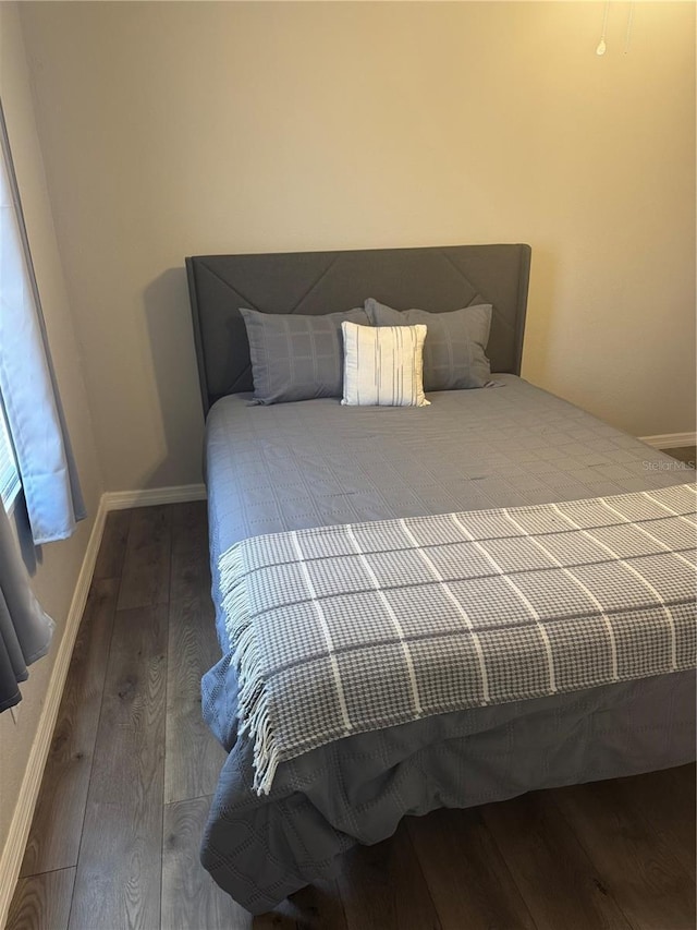 9400 SE 119th St, Belleview, FL 34420 - bedroom featuring hardwood / wood-style flooring and baseboards