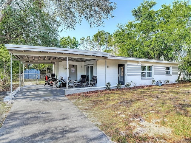 741 Hillview Dr, Altamonte Springs, FL 32714 - ranch-style house featuring a carport, a gate, driveway, and fence