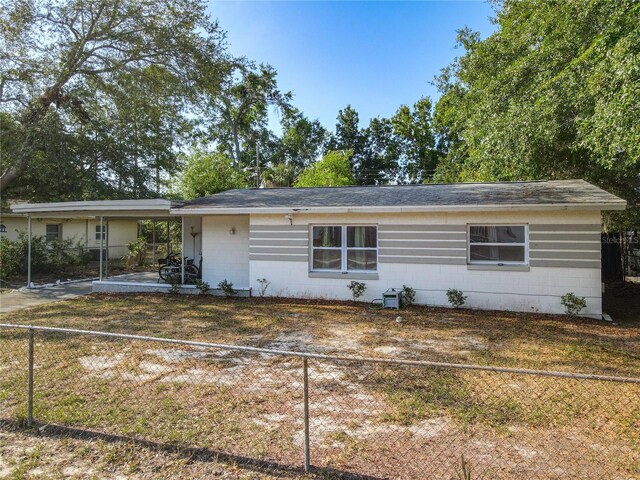 741 Hillview Dr, Altamonte Springs, FL 32714 - ranch-style house with an attached carport, concrete block siding, and a fenced backyard