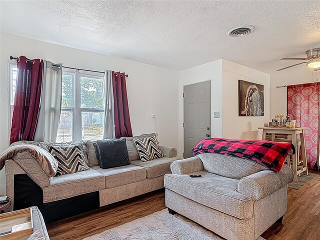 741 Hillview Dr, Altamonte Springs, FL 32714 - living room featuring visible vents, wood finished floors, ceiling fan, and a textured ceiling