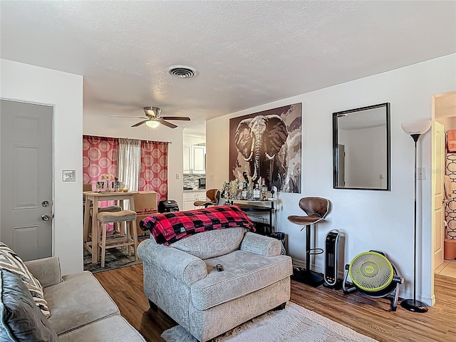 741 Hillview Dr, Altamonte Springs, FL 32714 - living room featuring visible vents, wood finished floors, and a ceiling fan