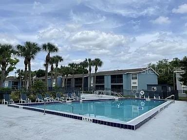 2517 N Alafaya Trl Unit 31, Orlando, FL 32826 - community pool featuring fence