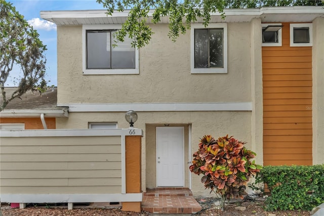 rear view of property with stucco siding