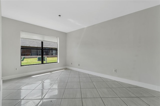tiled empty room with baseboards