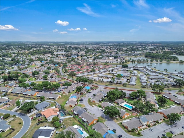 birds eye view of property featuring a water view and a residential view