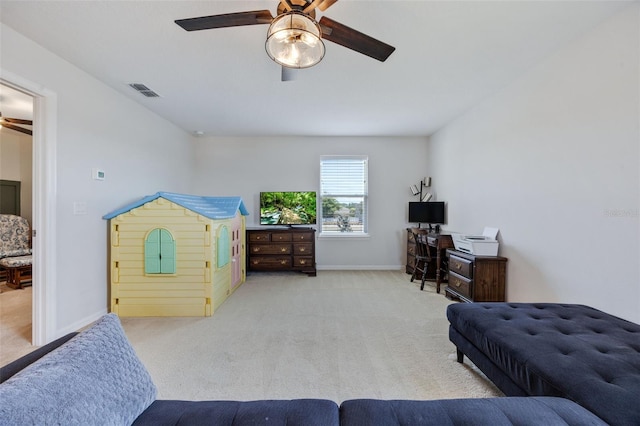 carpeted bedroom with baseboards, a ceiling fan, and visible vents