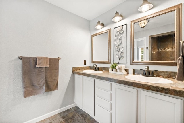 955 Seminole St, Clermont, FL 34711 - bathroom with baseboards, a sink, and double vanity