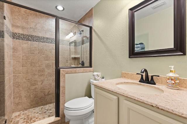 955 Seminole St, Clermont, FL 34711 - full bathroom with vanity, visible vents, a textured wall, toilet, and a stall shower