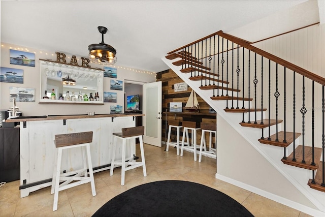 955 Seminole St, Clermont, FL 34711 - bar with pendant lighting, a bar, stairs, and light tile patterned flooring