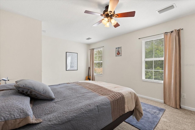 955 Seminole St, Clermont, FL 34711 - bedroom featuring ceiling fan, visible vents, light carpet, and baseboards