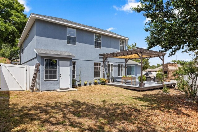 955 Seminole St, Clermont, FL 34711 - rear view of property with fence, a pergola, a deck, a gate, and a yard