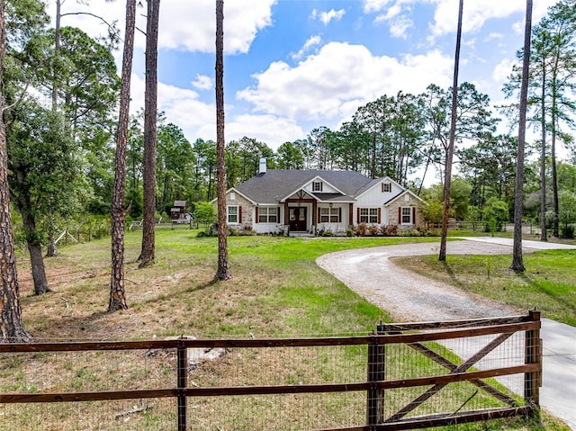 42368 W Cashew Ct, Eustis, FL 32736 - view of front of property featuring a chimney, a front lawn, fence, and curved driveway