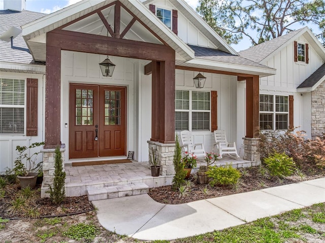 42368 W Cashew Ct, Eustis, FL 32736 - property entrance with covered porch, board and batten siding, stone siding, and roof with shingles