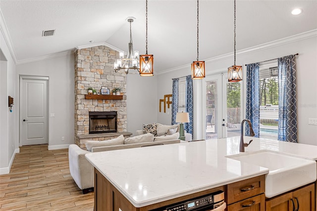 42368 W Cashew Ct, Eustis, FL 32736 - kitchen featuring a sink, a notable chandelier, light wood-type flooring, crown molding, and vaulted ceiling