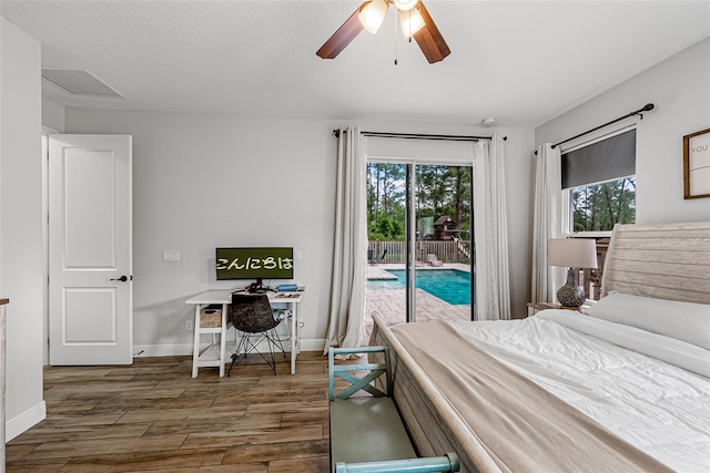 42368 W Cashew Ct, Eustis, FL 32736 - bedroom with baseboards, visible vents, access to exterior, and wood finished floors