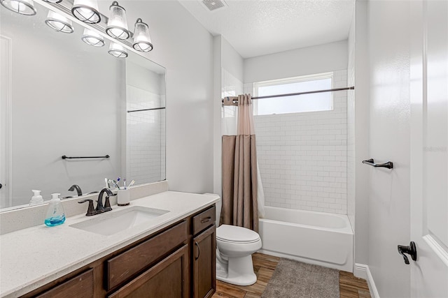 42368 W Cashew Ct, Eustis, FL 32736 - full bathroom featuring visible vents, shower / tub combo with curtain, toilet, wood finished floors, and vanity