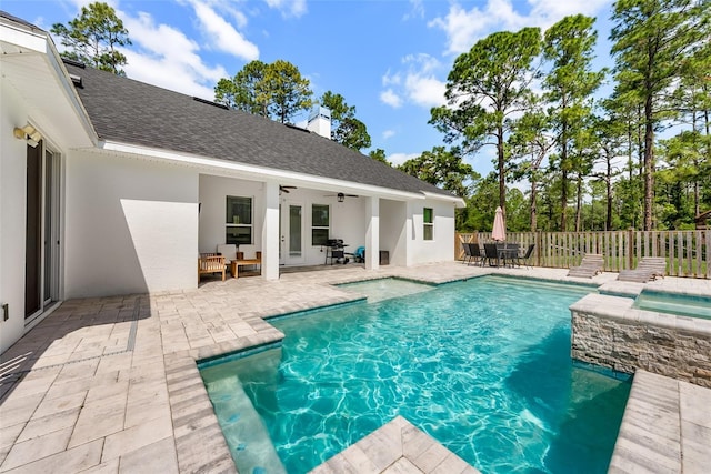 42368 W Cashew Ct, Eustis, FL 32736 - view of swimming pool featuring a patio, an in ground hot tub, a fenced in pool, fence, and a ceiling fan