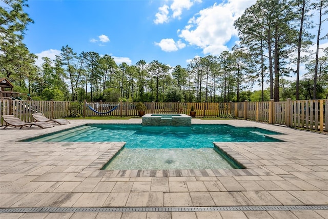 42368 W Cashew Ct, Eustis, FL 32736 - view of pool with a fenced backyard, a pool with connected hot tub, and a patio area