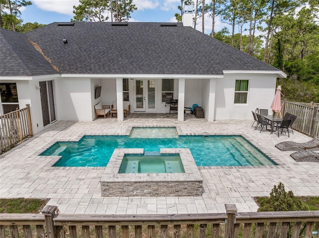 42368 W Cashew Ct, Eustis, FL 32736 - back of property featuring a pool with connected hot tub, a shingled roof, stucco siding, and french doors