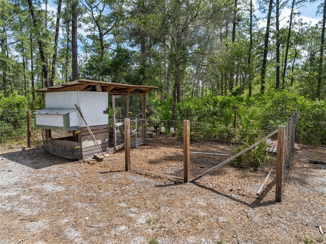 42368 W Cashew Ct, Eustis, FL 32736 - view of yard with fence, exterior structure, and an outbuilding