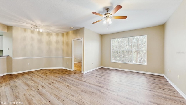 spare room featuring ceiling fan and wood finished floors