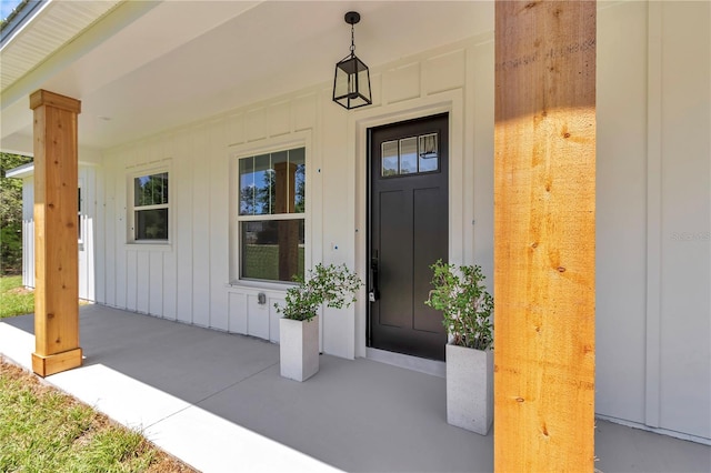 6725 SW 131st Cir, Ocala, FL 34481 - doorway to property with board and batten siding and covered porch