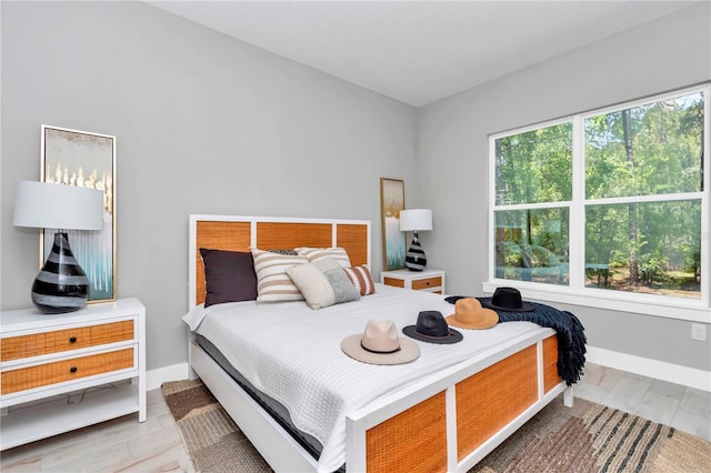 6725 SW 131st Cir, Ocala, FL 34481 - bedroom with baseboards and wood finished floors