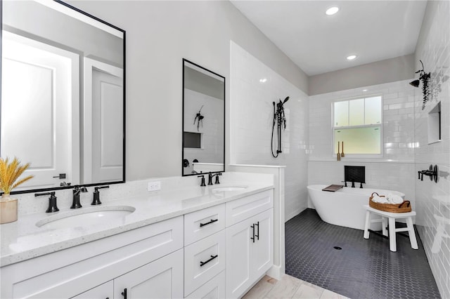 6725 SW 131st Cir, Ocala, FL 34481 - bathroom featuring a sink, recessed lighting, double vanity, and a freestanding bath