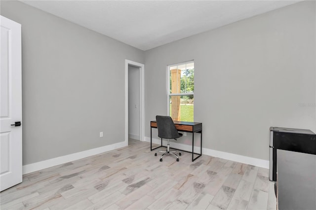 6725 SW 131st Cir, Ocala, FL 34481 - home office with baseboards and light wood-style floors
