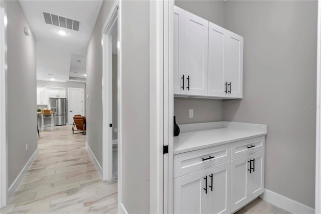 6725 SW 131st Cir, Ocala, FL 34481 - hall featuring visible vents, recessed lighting, baseboards, and light wood-type flooring