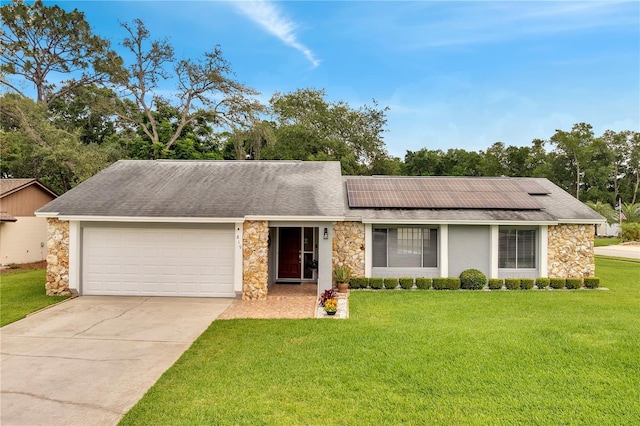 819 Haulover Dr, Altamonte Springs, FL 32714 - view of front facade with stone siding, an attached garage, and roof mounted solar panels