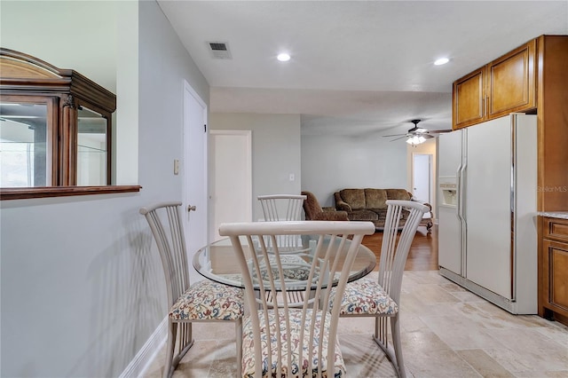 819 Haulover Dr, Altamonte Springs, FL 32714 - dining space with recessed lighting, a ceiling fan, and light stone finish floors