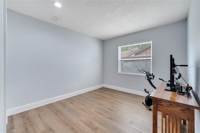 819 Haulover Dr, Altamonte Springs, FL 32714 - office area featuring light wood-style floors, baseboards, a textured ceiling, and recessed lighting