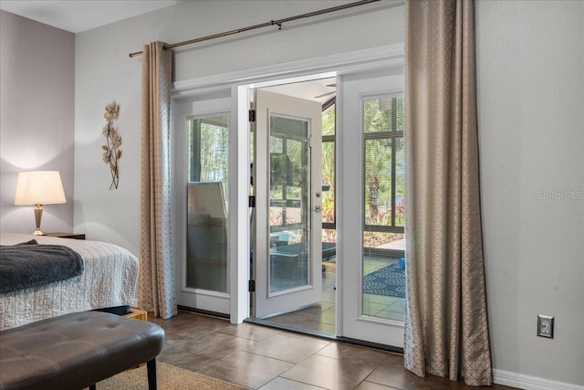 entryway featuring ceiling fan and a wealth of natural light