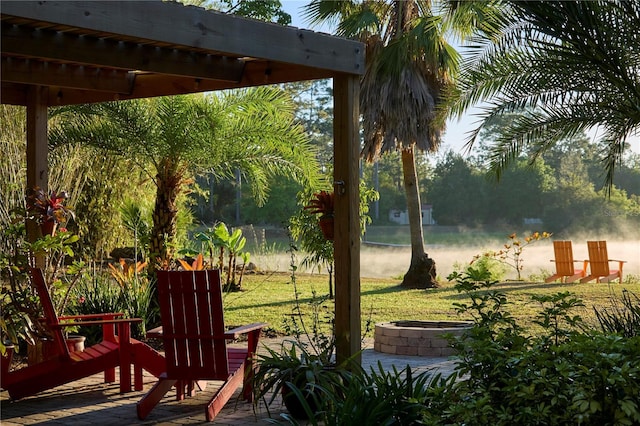 view of yard featuring an outdoor fire pit