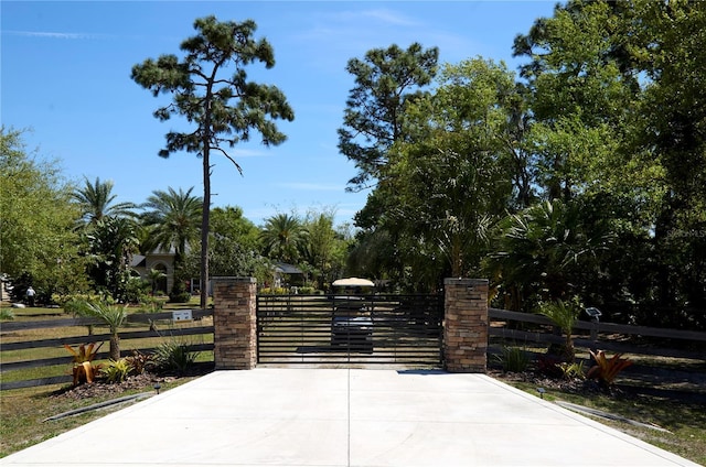 view of gate with fence