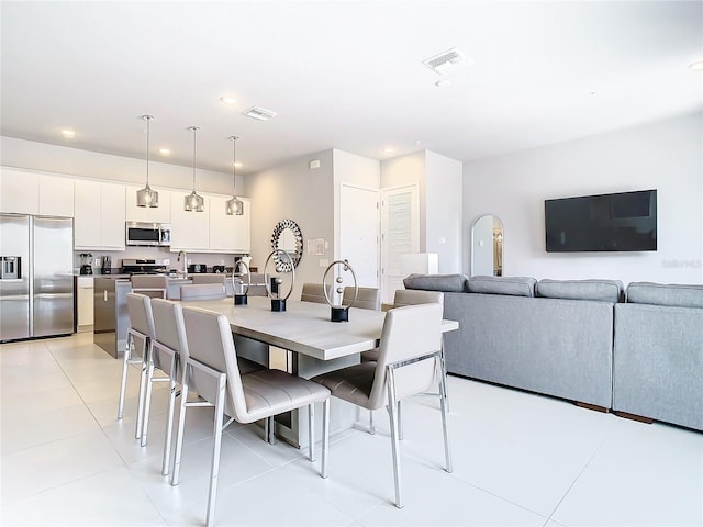 7770 Sandy Ridge Dr Unit 139, Reunion, FL 34747 - dining area featuring light tile patterned flooring, visible vents, and recessed lighting