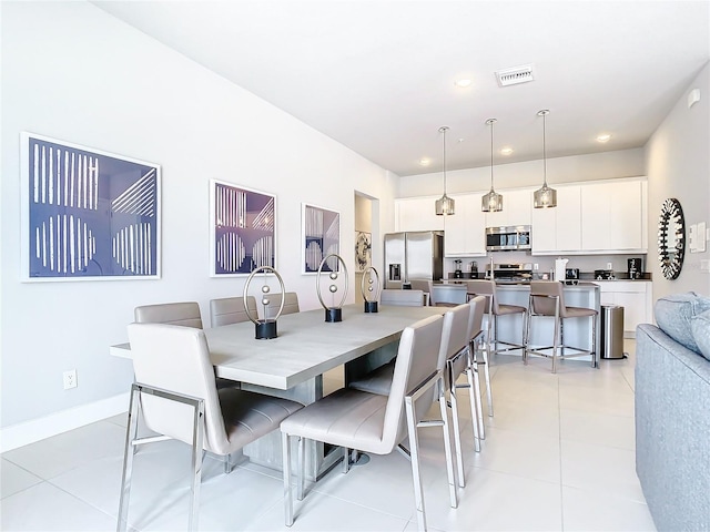7770 Sandy Ridge Dr Unit 139, Reunion, FL 34747 - dining area featuring baseboards, visible vents, recessed lighting, and light tile patterned floors
