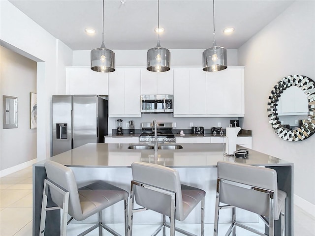 7770 Sandy Ridge Dr Unit 139, Reunion, FL 34747 - kitchen featuring stainless steel appliances, baseboards, a sink, and white cabinetry