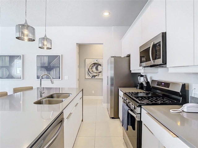 7770 Sandy Ridge Dr Unit 139, Reunion, FL 34747 - kitchen featuring white cabinets, light tile patterned floors, stainless steel appliances, and a sink