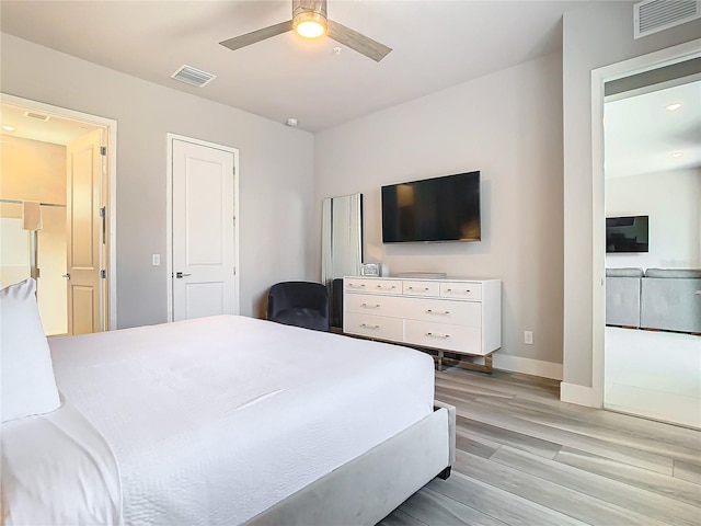 7770 Sandy Ridge Dr Unit 139, Reunion, FL 34747 - bedroom with light wood-type flooring, visible vents, baseboards, and ceiling fan