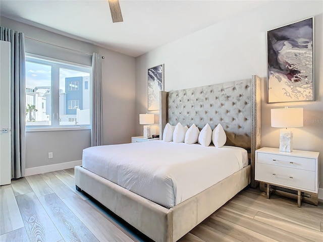 7770 Sandy Ridge Dr Unit 139, Reunion, FL 34747 - bedroom with baseboards and light wood-style floors