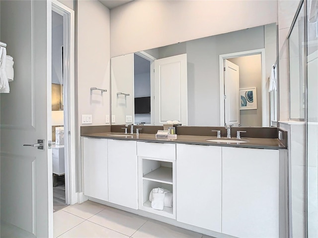 7770 Sandy Ridge Dr Unit 139, Reunion, FL 34747 - bathroom with tile patterned floors, a sink, a shower, and double vanity