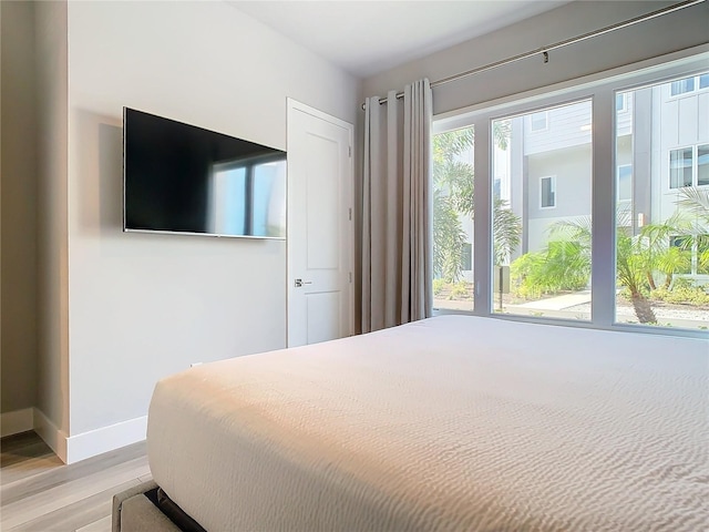 7770 Sandy Ridge Dr Unit 139, Reunion, FL 34747 - bedroom featuring light wood-style flooring and baseboards