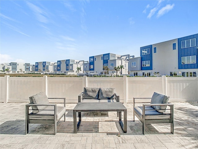 7770 Sandy Ridge Dr Unit 139, Reunion, FL 34747 - view of patio featuring an outdoor hangout area, a residential view, and fence