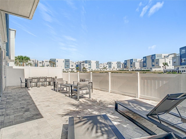 7770 Sandy Ridge Dr Unit 139, Reunion, FL 34747 - view of patio / terrace with outdoor dining area, fence, and a residential view